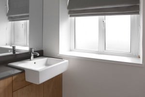 Soft grey roller blinds for bathroom
